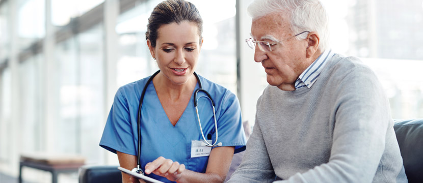 A doctor showing the Diabetes Pathway to a man who is living with diabetes.